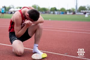 Nebraska Cornhusker Dyson Wicker prays during the Big Ten OTF Championships on May 17, 2026, in Lincoln, Nebraska. Photo by Brandon Tiedemann.