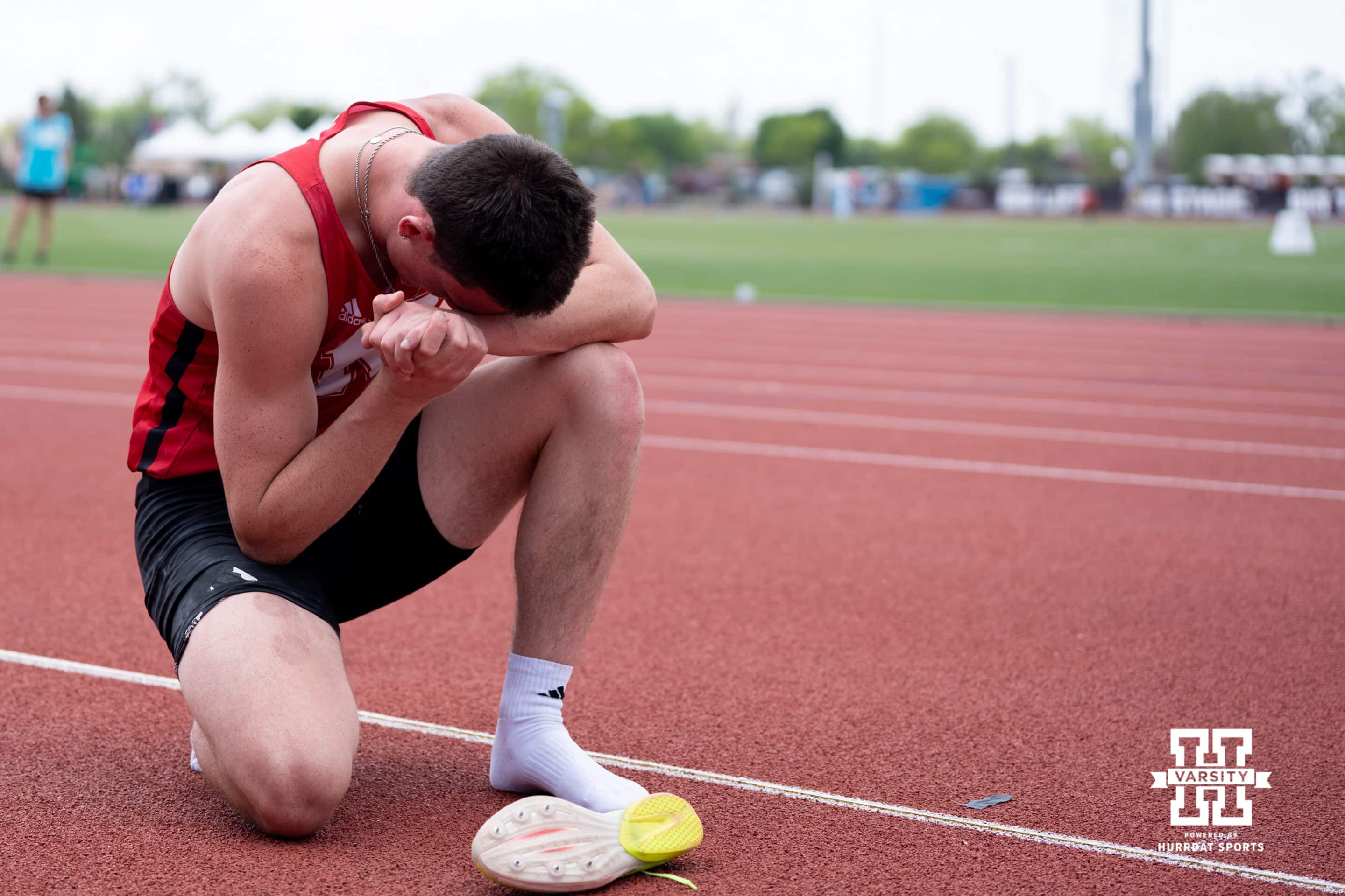 Nebraska Cornhusker Dyson Wicker prays during the Big Ten OTF Championships on May 17, 2026, in Lincoln, Nebraska. Photo by Brandon Tiedemann.