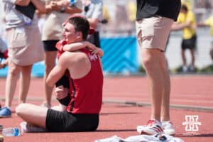 Nebraska Cornhusker Dyson Wicker hugs someone during the Big Ten OTF Championships on May 17, 2026, in Lincoln, Nebraska. Photo by Brandon Tiedemann.