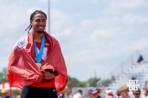 Nebraska Cornhusker James Ledbetter stands on the podium during the Big Ten OTF Championships on May 17, 2026, in Lincoln, Nebraska. Photo by Brandon Tiedemann.
