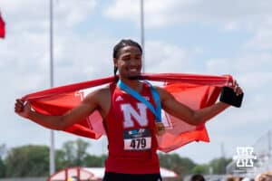 Nebraska Cornhusker James Ledbetter poses on the podium during the Big Ten OTF Championships on May 17, 2026, in Lincoln, Nebraska. Photo by Brandon Tiedemann.