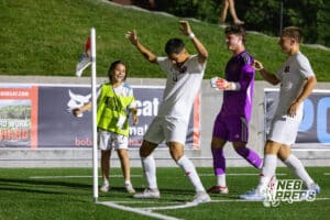Omaha Westside’s Armani Dircio (9) is celebrating with his teammates after scoring a goal during semi-finals of the NSAA State Soccer Championships on Friday, May 15, 2026, in Omaha, Nebraska. Photo By Jack Stephens.