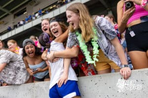 Omaha Marian’s Cleo Washington (7) is embracing a loved one in the crowd after winning a high school state semi-finals soccer game against Kearney on Friday, May 15, 2026, in Omaha, Nebraska. Photo By Jack Stephens.