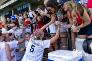Elkhorn South’s Aubrey Marsh (5) is celebrating with the crowd after winning a high school state semifinals soccer game against Lincoln Southwest on Friday, May 15 2026 in Omaha, Nebraska. Photo By Jack Stephens.