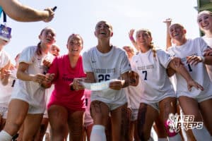 Elkhorn South’s Ellie Sonderman (26) is slapping the Storm’s name on the bracket board after scoring after winning a high school state semifinals soccer game against Lincoln Southwest on Friday, May 15 2026 in Omaha, Nebraska. Photo By Jack Stephens.