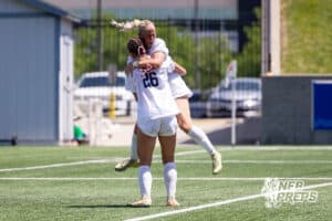 Elkhorn South’s Ellie Sonderman (26) is celebrating with her teammate after scoring a goal against Lincoln Southwest during semi-finals of the NSAA State Soccer Championships on Friday, May 15, 2026, in Omaha, Nebraska. Photo By Jack Stephens.