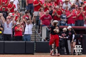 Nebraska Cornhuskers pitcher Jordy Frahm (98) and catcher Jesse Farrell (25) hug after the win over the Grand Canyon Antelopes during the NCAA Softball Regionals on Saturday, May 16, 2026, in Lincoln, Neb. Photo by John S. Peterson.