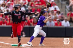 Nebraska Cornhusker Jordy Frahm (98) safely makes to first base against Grand Canyon Antelope utility Emily Gonzalez (26) in the seventh inning during the NCAA Softball Regionals on Saturday, May 16, 2026, in Lincoln, Neb. Photo by John S. Peterson.