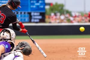 Nebraska Cornhusker outfielder Hannah Coor (23) triples in the fifth driving in Jordy Frahm against the Grand Canyon Antelopes during the NCAA Softball Regionals on Saturday, May 16, 2026, in Lincoln, Neb. Photo by John S. Peterson.