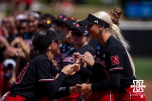Nebraska Cornhuskers Samantha Bland (29) and Skarlett Jones (0) shake hands for the introductions before taking on the Grand Canyon Antelopes during the NCAA Softball Regionals on Saturday, May 16, 2026, in Lincoln, Neb. Photo by John S. Peterson.