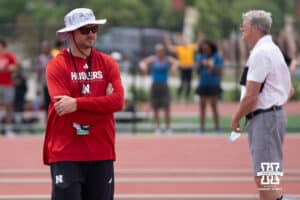 Nebraska Cornhusker coach Dusty Jonas walks during the Big Ten OTF Championships on May 16, 2026, in Lincoln, Nebraska. Photo by Brandon Tiedemann.