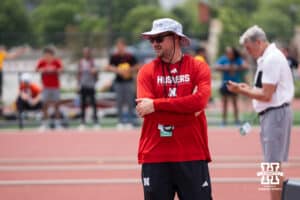 Nebraska Cornhusker coach Dusty Jonas walks during the Big Ten OTF Championships on May 16, 2026, in Lincoln, Nebraska. Photo by Brandon Tiedemann.