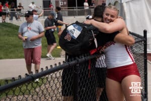Nebraska Cornhusker Axelina Johansson hugs a teammate during the Big Ten OTF Championships on May 16, 2026, in Lincoln, Nebraska. Photo by Brandon Tiedemann.