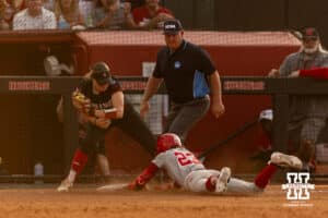 Nebraska Cornhusker Hannah Coor (23) slides at third against South Dakota Coyote infielder Brooke Carey (20), after hitting a one-run triple in the fifth during the first round of the NCAA Softball Regionals on Friday, May 15, 2026, in Lincoln, Neb. Photo by John S. Peterson.