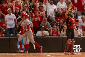 Nebraska Cornhusker Jordyn Frahm (98) scores a run from Hannah Coor triple in the fifth against the South Dakota Coyotes during the first round of the NCAA Softball Regionals on Friday, May 15, 2026, in Lincoln, Neb. Photo by John S. Peterson.
