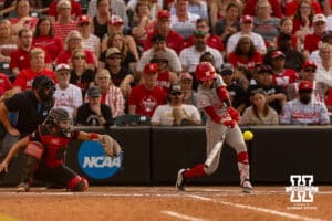 Nebraska Cornhusker Hannah Coor (23) gets a hit for a one run triple against the South Dakota Coyotes in the fifth inning during the first round of the NCAA Softball Regionals on Friday, May 15, 2026, in Lincoln, Neb. Photo by John S. Peterson.