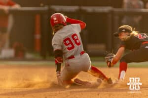 Nebraska Cornhusker starting pitcher/relief pitcher Jordyn Frahm (98) slides at second hitting a double against South Dakota Coyote infielder Kiya Johnson (2) in the fifth during the first round of the NCAA Softball Regionals on Friday, May 15, 2026, in Lincoln, Neb. Photo by John S. Peterson.