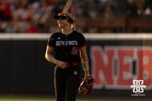 South Dakota Coyote outfielder Sara Iburg (24) takes her position in the outfield against the Nebraska Cornhuskers in the fouth inning during the first round of the NCAA Softball Regionals on Friday, May 15, 2026, in Lincoln, Neb. Photo by John S. Peterson.