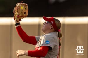 Nebraska Cornhusker outfielder Kacie Hoffmann (14) makes a catch for an out against the South Dakota Coyotes in the fourth inning during the first round of the NCAA Softball Regionals on Friday, May 15, 2026, in Lincoln, Neb. Photo by John S. Peterson.