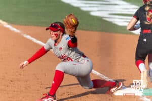 Nebraska Cornhusker starting pitcher/relief pitcher Jordyn Frahm (98) makes a force out against South Dakota Coyote outfielder Ella McGee (6) in the third inning during the first round of the NCAA Softball Regionals on Friday, May 15, 2026, in Lincoln, Neb. Photo by John S. Peterson.