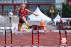 Nebraska Cornhusker Ava Alexander jumps over a hurdle during the Big Ten OTF Championships on May 15, 2026, in Lincoln, Nebraska. Photo by Brandon Tiedemann.