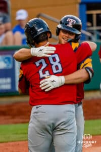Toledo Mud Hen Max Anderson (23) hugging Eduardo Valencia (28) after hitting a home run during a minor league baseball game against the Omaha Storm Chasers on Tuesday, May 12, 2026, in Omaha, Neb. Photo by Jandi Green.