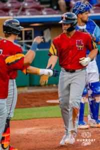 Toledo Mud Hen Max Anderson (23) high fiving teammates after hitting a homerun during a minor league baseball game against the Omaha Storm Chasers on Tuesday, May 12, 2026, in Omaha, Neb. Photo by Jandi Green.