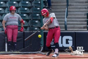Nebraska Cornhusker infielder Bella Bacon (3) gets a hit during practice for the first round of the NCAA Championships on Thursday, May 14, 2026, in Lincoln, Neb. Photo by John S. Peterson.