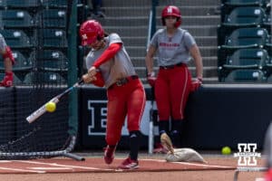 Nebraska Cornhusker infielder Lauren Camenzind (2) gets a hit during practice for the first round of the NCAA Championships on Thursday, May 14, 2026, in Lincoln, Neb. Photo by John S. Peterson.