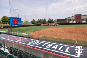 Nebraska Cornhuskers meet in the outfield before getting started with practice during practice for first round of the NCAA Championships on Thursday, May 14, 2026, in Lincoln, Neb. Photo by John S. Peterson.
