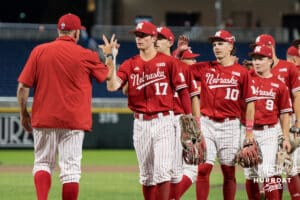 The Nebraska Cornhuskers celebrate their win over Creighton after a college baseball game on May 12, 2026, in Omaha, Nebraska. Photo by Brandon Tiedemann.