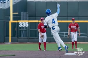 Creighton Bluejay Teddy Deters (4) celebrates a homerun during a college baseball game on May 12, 2026, in Omaha, Nebraska. Photo by Brandon Tiedemann.