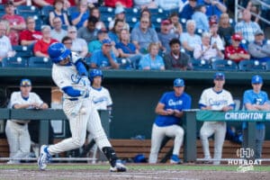 Creighton Bluejay Chris Baillargeon (22) hits the ball during a college baseball game on May 12, 2026, in Omaha, Nebraska. Photo by Brandon Tiedemann.