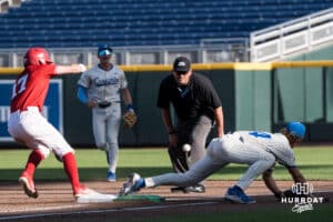 Nebraska Cornhusker Mac Moyer (17) beats the throw during a college baseball game on May 12, 2026, in Omaha, Nebraska. Photo by Brandon Tiedemann.
