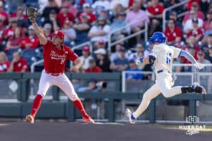 Nebraska Cornhusker infielder Case Sanderson (14) makes a catch to force out Creighton Bluejay infielder Ben North (11) to finish a double-0play in the first inning during a college baseball game on Tuesday, May 12, 2026, in Omaha, Neb. Photo by John S. Peterson.