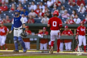 Nebraska Cornhusker Jeter Worthley (0) scores a run against the Creighton Bluejays in the first inning during a college baseball game on Tuesday, May 12, 2026, in Omaha, Neb. Photo by John S. Peterson.