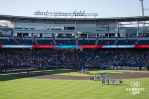 The Nebraska Cornhuskers and Creighton Bluejays stand for the anthem during a college baseball game on May 12, 2026, in Omaha, Nebraska. Photo by Brandon Tiedemann.