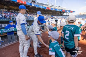 Creighton Bluejay pitcher Jack Pineau (13) gives a little leaguer five before the game against the Nebraska Cornhuskers during a college baseball game on Tuesday, May 12, 2026, in Omaha, Neb. Photo by John S. Peterson.