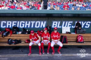 Nebraska Cornhuskers Jett Buck (1), Drew Grego, and Max Buettenback hanging out in the dugout before the start of the game against the Creighton Bluejays during a college baseball game on Tuesday, May 12, 2026, in Omaha, Neb. Photo by John S. Peterson.