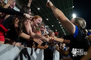 Omaha Marian celebrates the win with the student section against Lincoln Southeast during the girls' Class A soccer match against Lincoln Southeast on Monday, May 11, 2026, in Omaha, Nebraska. Photo by Jackson D. Luethje.