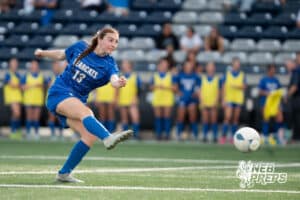 Kearney's Taryn Thieszen (13) passes during the girls quarter-final soccer match against Millard South on Monday, May 11, 2026, in Omaha, Nebraska. Photo by Jackson D. Luethje.