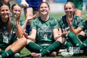 Lincoln Southwest's Ansley Throener (9) celebrates with the team during the girls Class A quarter-final soccer match against Lincoln East on Monday, May 11, 2026, in Omaha, Nebraska. Photo by Jackson D. Luethje.