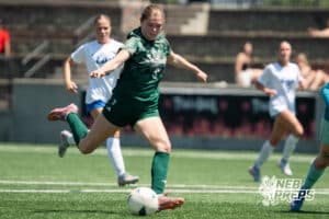 Lincoln Southwest's Ansley Throener (9) scores a goal during the girls Class A quarter-final soccer match against Lincoln East on Monday, May 11, 2026, in Omaha, Nebraska. Photo by Jackson D. Luethje.