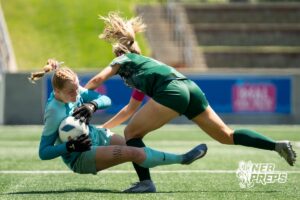 Lincoln Southwest's Peyton Held (12) collides with Lincoln East's Emma Eilers (31) during the girls Class A quarter-final soccer match on Monday, May 11, 2026, in Omaha, Nebraska. Photo by Jackson D. Luethje.