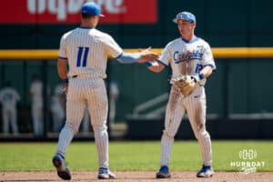 Creighton Bluejay Nick Venteicher (12) and Ben North (11) shake hands during a college baseball game vs Georgetown on Sunday, May 10, 2026, in Omaha, Nebraska. Photo by Jackson D. Luethje.