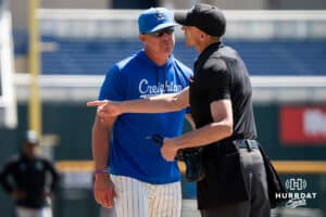 Creighton Head Coach Mark Kingston argues with home plate umpire during a college baseball game vs Georgetown on Sunday, May 10, 2026, in Omaha, Nebraska. Photo by Jackson D. Luethje.