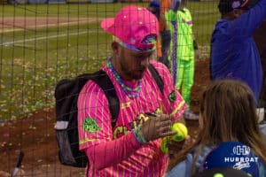 Chili Peppers player signing a baseball after a Cosmic Baseball game on Saturday, May 9, 2026, in Omaha, Neb. Photo by Jandi Green.