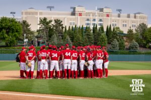 Nebraska Cornhuskers huddle after the win against the Iowa Hawkeyes during a college baseball game on Saturday, May 9, 2026, in Lincoln, Neb. Photo by John S. Peterson.