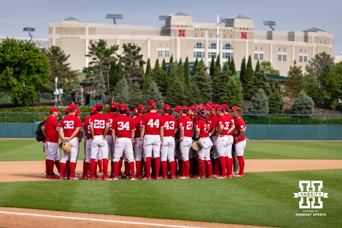 Nebraska Cornhuskers huddle after the win against the Iowa Hawkeyes during a college baseball game on Saturday, May 9, 2026, in Lincoln, Neb. Photo by John S. Peterson.
