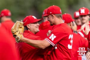 Nebraska Cornhusker head coach Will Bolt shakes hands with closer Tucker Timmerman (32) after the win against the Iowa Hawkeyes during a college baseball game on Saturday, May 9, 2026, in Lincoln, Neb. Photo by John S. Peterson.